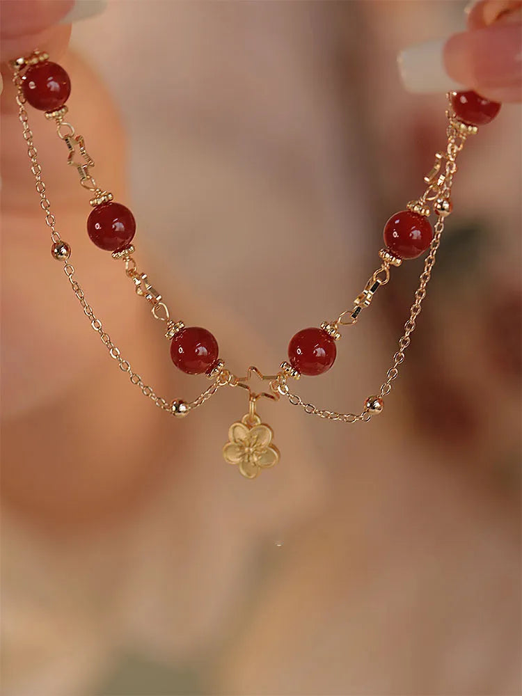 Red agate double layer women's bracelet with floral and peach blossom designs on natural stone