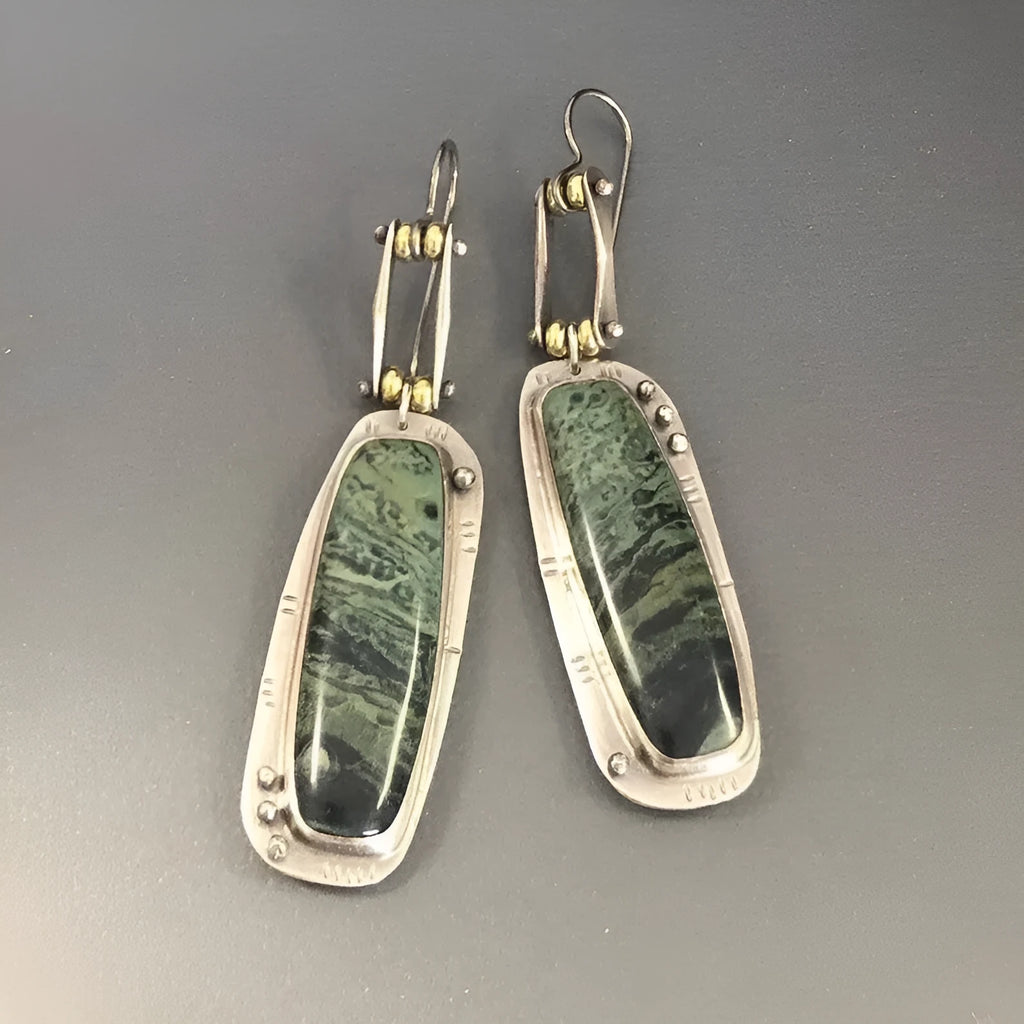 Two-tone geometric marble pattern drop earrings in alloy metal showing contrasting colours