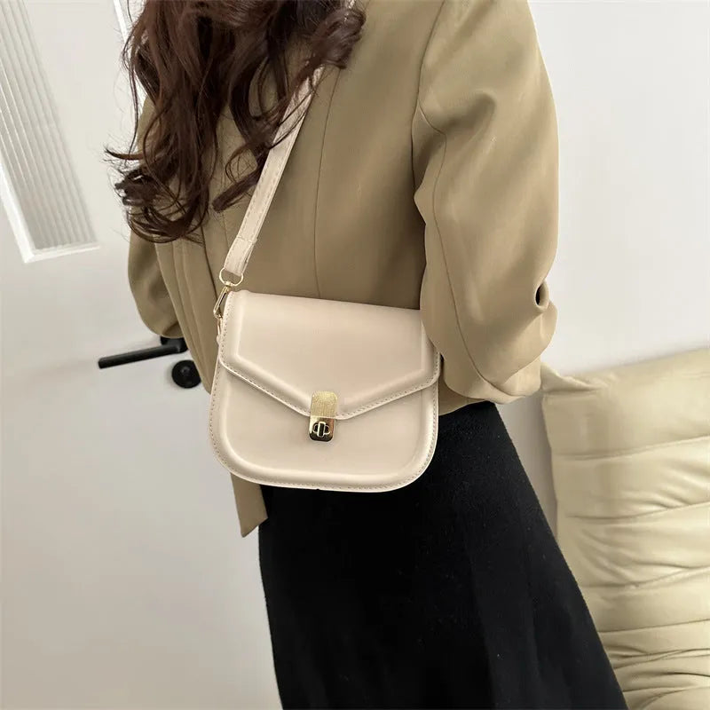 Soft textured PU leather messenger bag with clamshell opening, shown in a horizontal square shape.