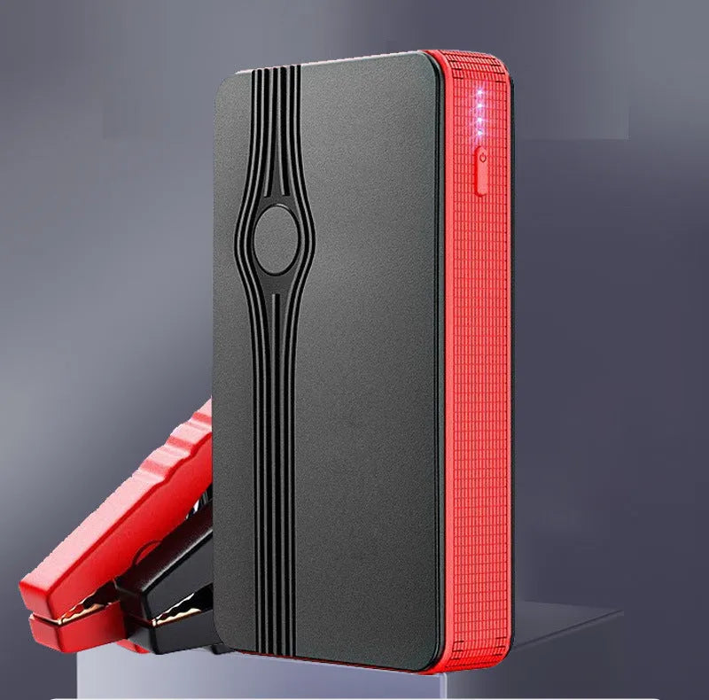 Red K4-E automobile emergency jump starter and power bank with data cable, compact rectangular design