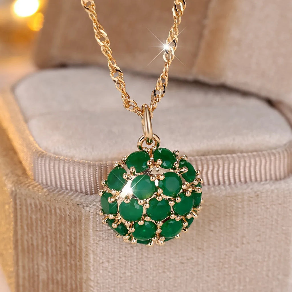 Round emerald and diamond pendant necklace in champagne gold colour on copper chain