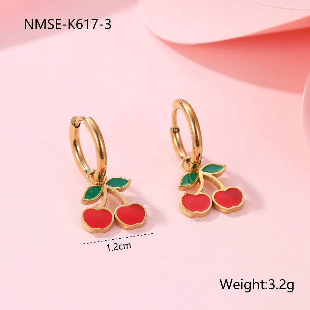 Cherry jewellery set showing necklace, bracelet, earrings and ring with geometric fruit designs on stainless steel chains