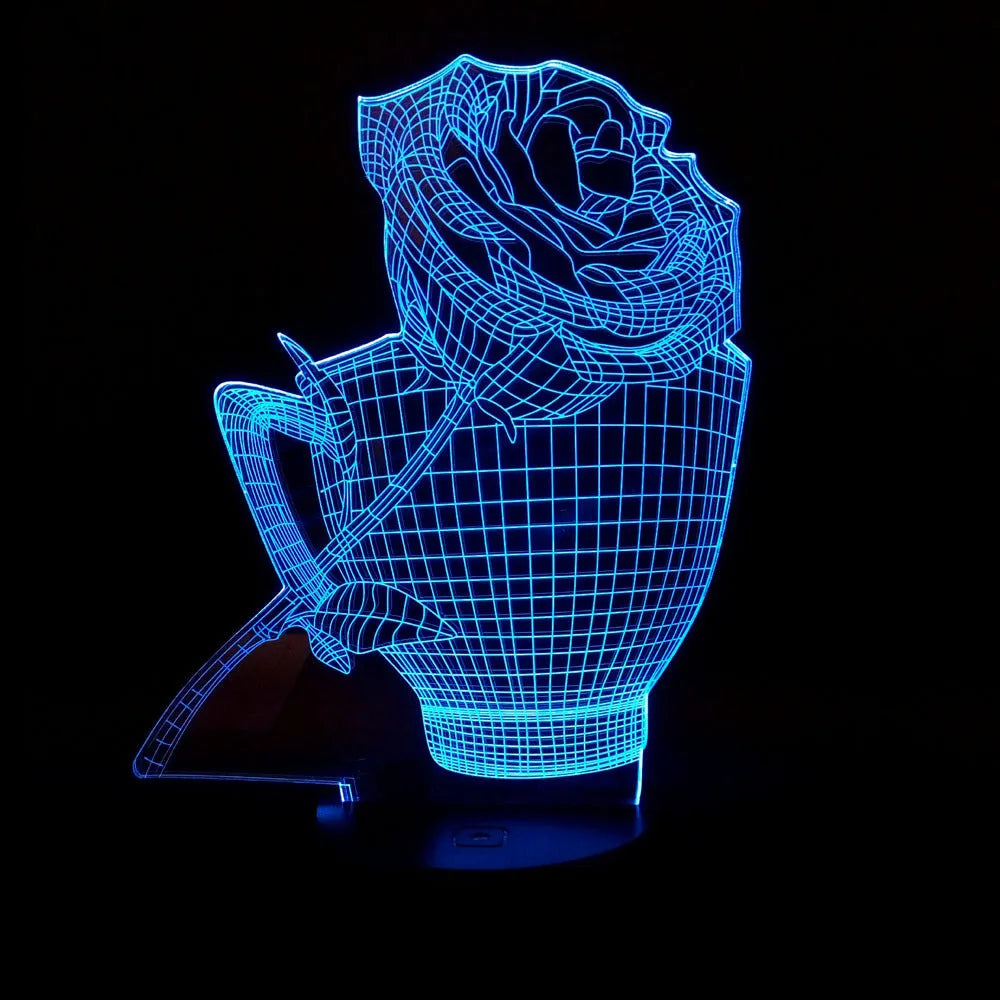 3D acrylic rose flower LED night light with remote control on a dark surface, showing colourful illumination.