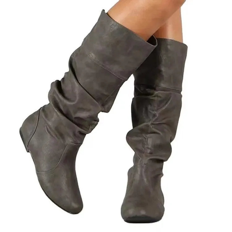 Women's black slip-on flat ankle boots with high shaft and round toe