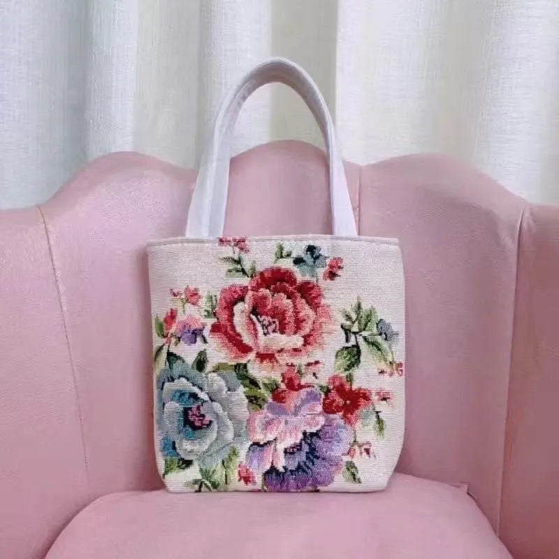 Canvas handbag with gold wire embroidery in floral and illustrative designs