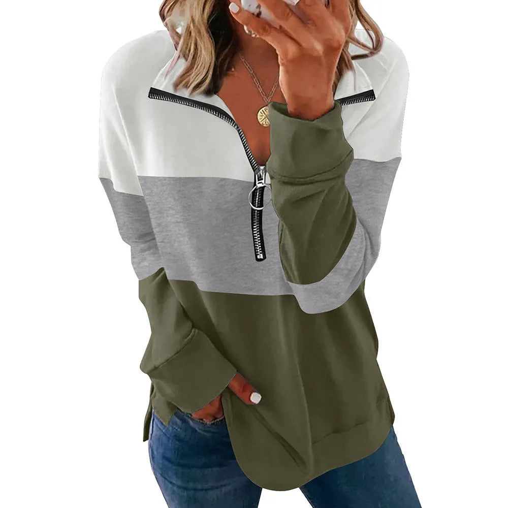 Women's loose fit leopard print long sleeve sweater in various colours on a hanger.