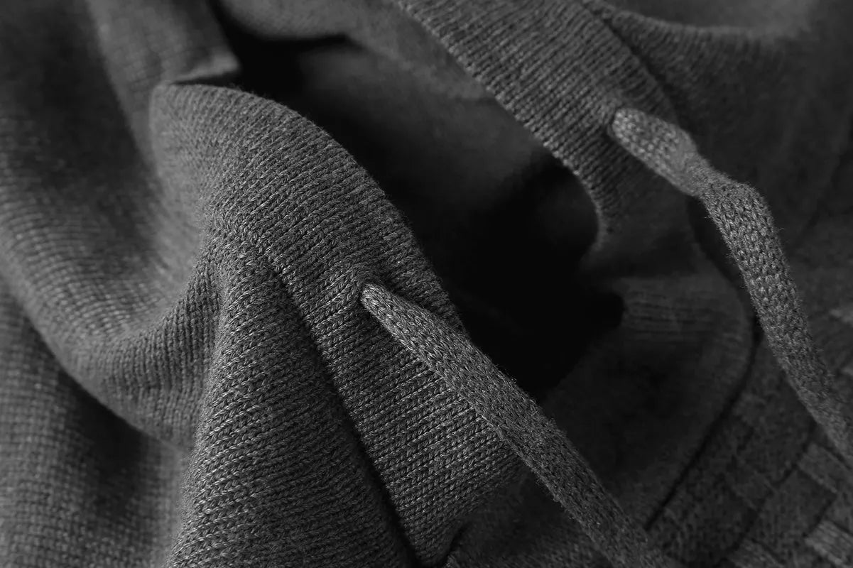 Men's black hoodie sweater made from cotton and polyester blend fabric.
