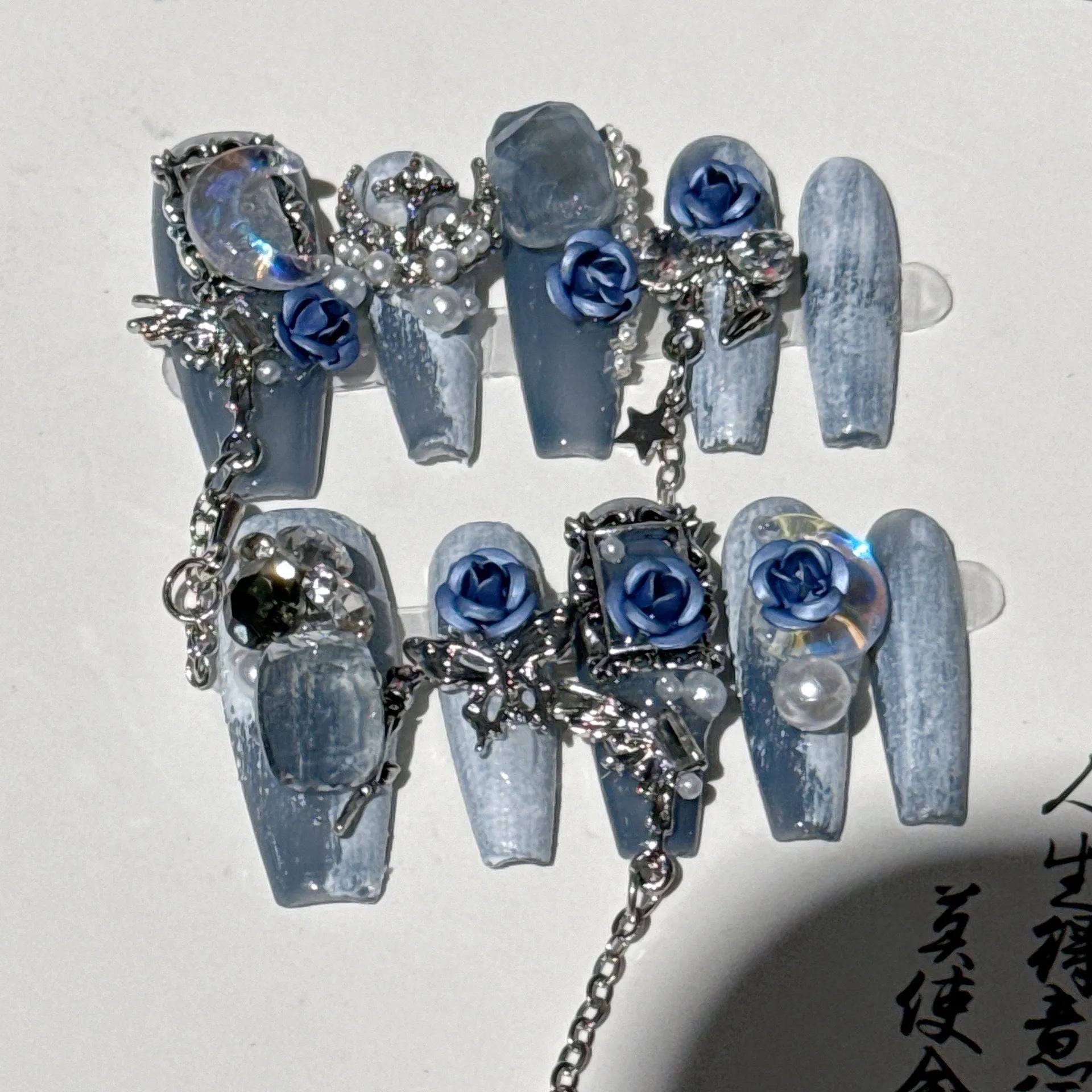 Heavy industry blue night nail stencils with ornate rose, tulip and flower patterns in plastic armour suit