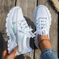 Women's Flyknit mesh lace-up sneakers in a grey colourway on a flat rubber sole.