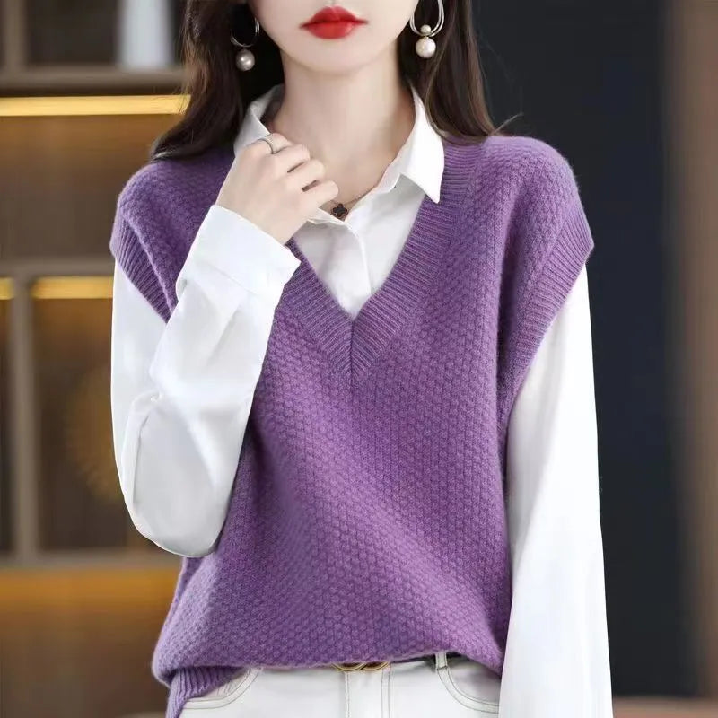 Creamy-white knitted sleeveless vest with 3D pattern and V-neck on a hanger