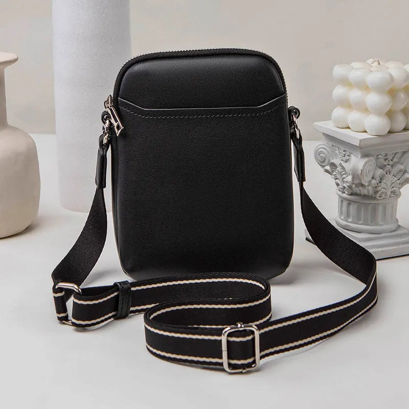 Solid colour small crossbody mobile phone bag in beige, showing front view and adjustable strap.