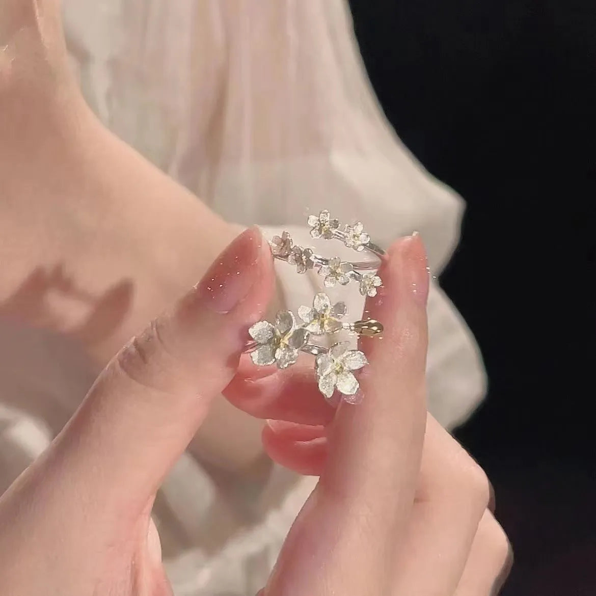 3D floral jasmine ring with heart, drop, and bell patterns on an adjustable open band.