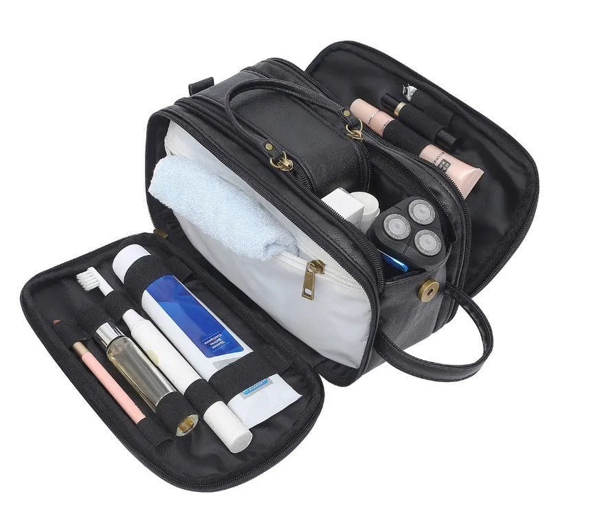 Men's black waterproof toiletry bag with multiple compartments open showing interior organisation