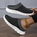 Women's black Flyknit slipper shoes with striped pattern and hollowed-out design on a viscose sole.