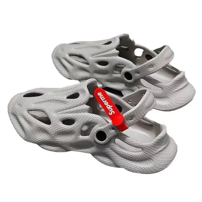 EVA foam coconut slippers with closed toe design and ventilation holes in grey colour