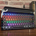 Black Dot Retro mechanical keyboard with colourful backlit keys on a desk.