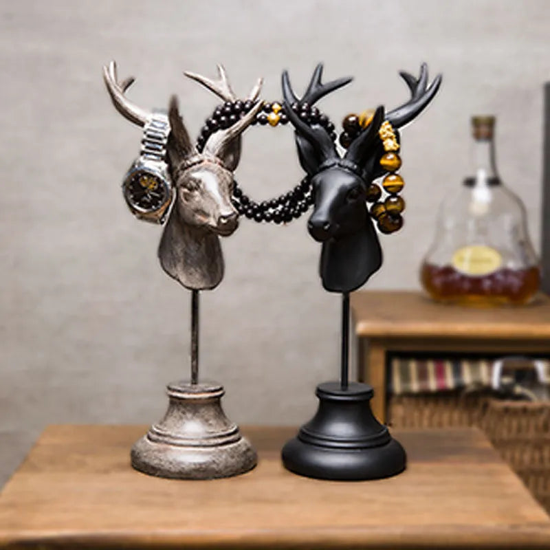 Natural resin decorative animal sculpture in black, white, or wood colour on a wooden table.