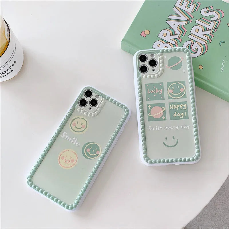 Green TPU iPhone case with polka dot frame and smiley face design on the back.