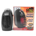 Black compact electric ceramic heater with digital display and rotating plug on desk