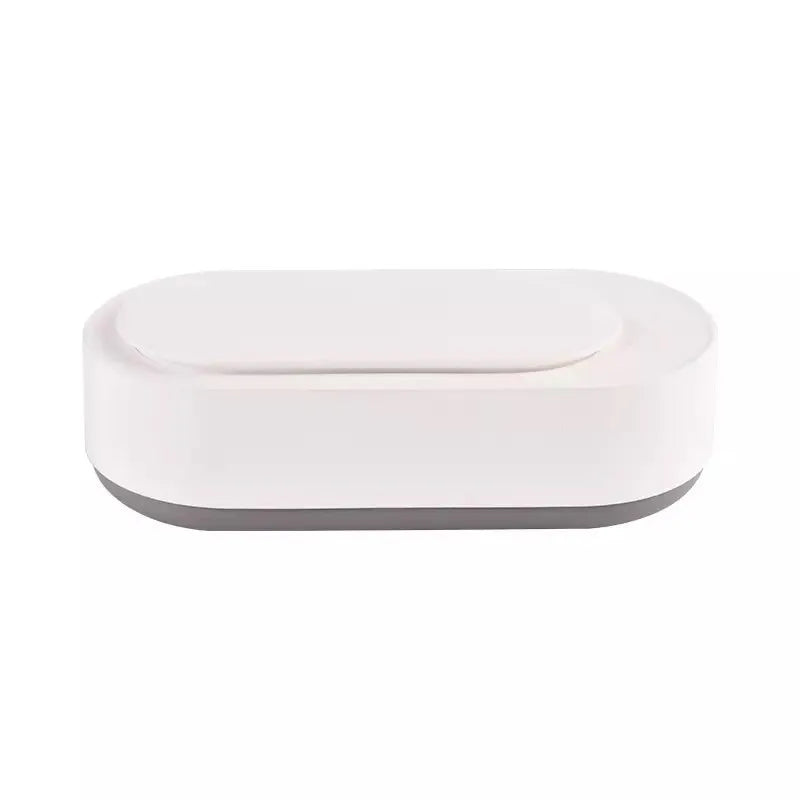 White portable ultrasonic cleaner machine with stainless steel tank for cleaning jewellery and glasses.
