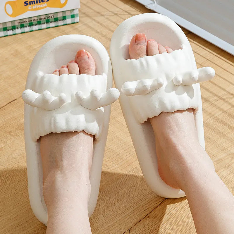 White women's flip flop slippers with deer horn design and hollow-out EVA upper on a light background.