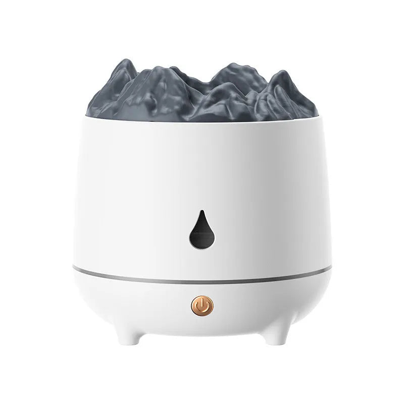 White volcano-shaped ultrasonic humidifier with USB cable on a wooden table.