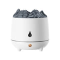 White volcano-shaped ultrasonic humidifier with USB cable on a wooden table.