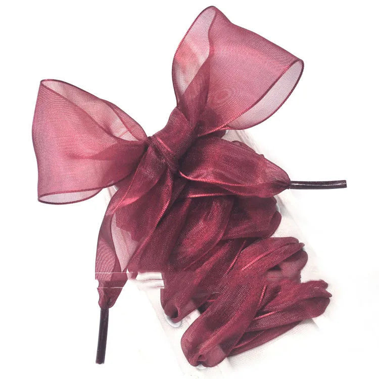 Wide transparent lace shoelaces in multiple solid colours showing 4cm width and length.