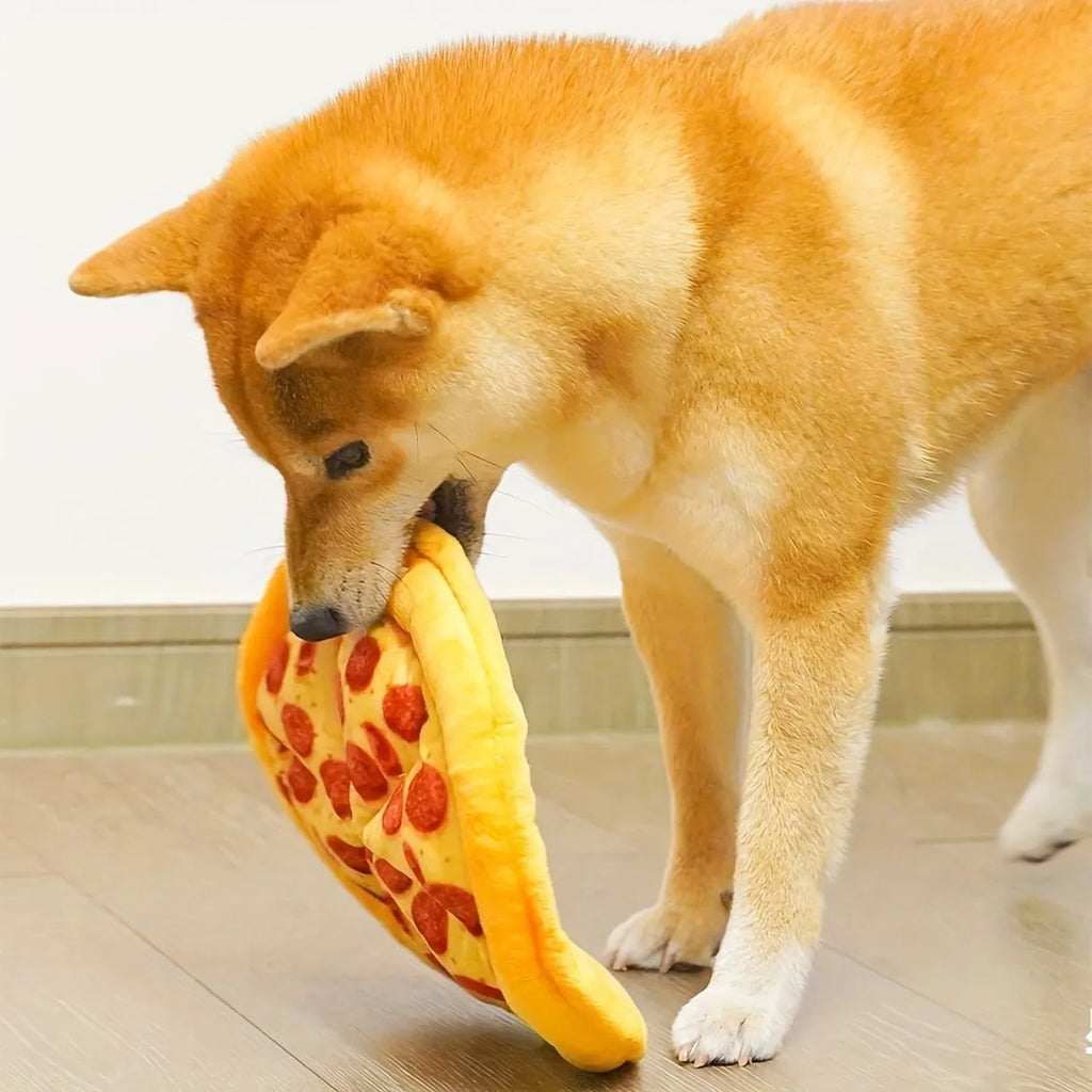 Yellow pizza-shaped squeaky dog toy for teeth grinding and chewing