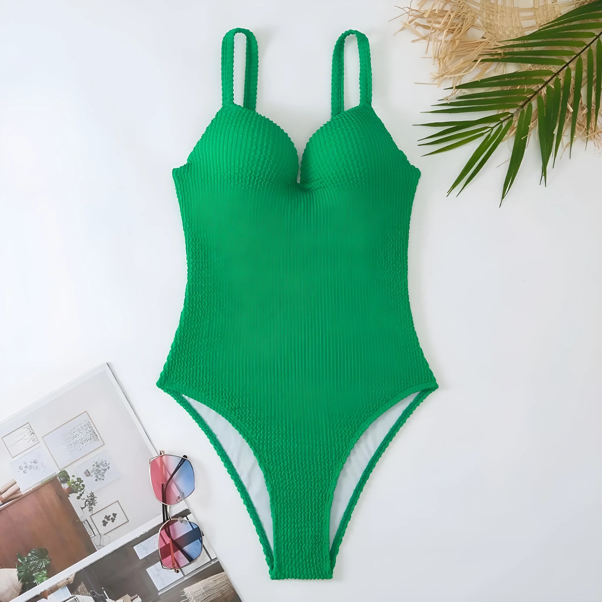 Women's black sunk-stripe one-piece swimsuit made from polyester fabric, sleeveless design.