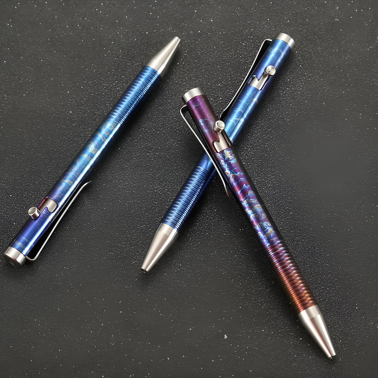 Titanium alloy tactical pen with gun bolt handle in a phantom colour finish.