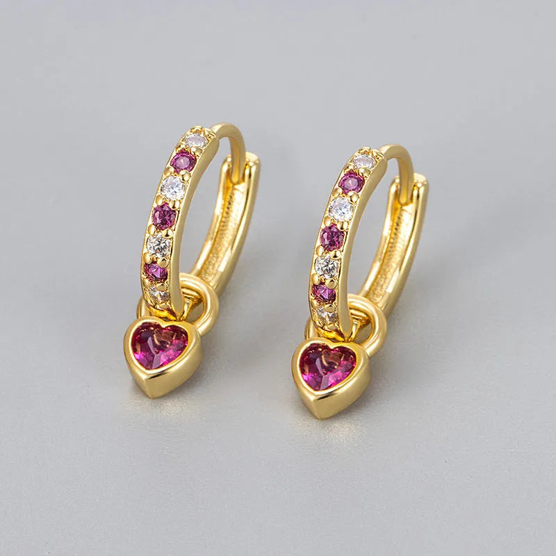 Women's heart-shaped ear clips with a coloured stone, available in gold or white gold colour.