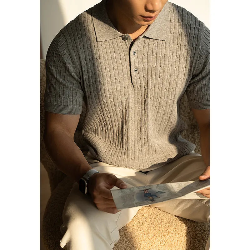 Men's khaki short sleeve business top on a hanger, showing the fabric texture and fit.