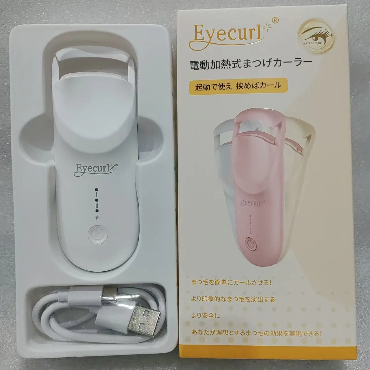 USB-rechargeable electric heating eyelash curler in cream white colour with cable