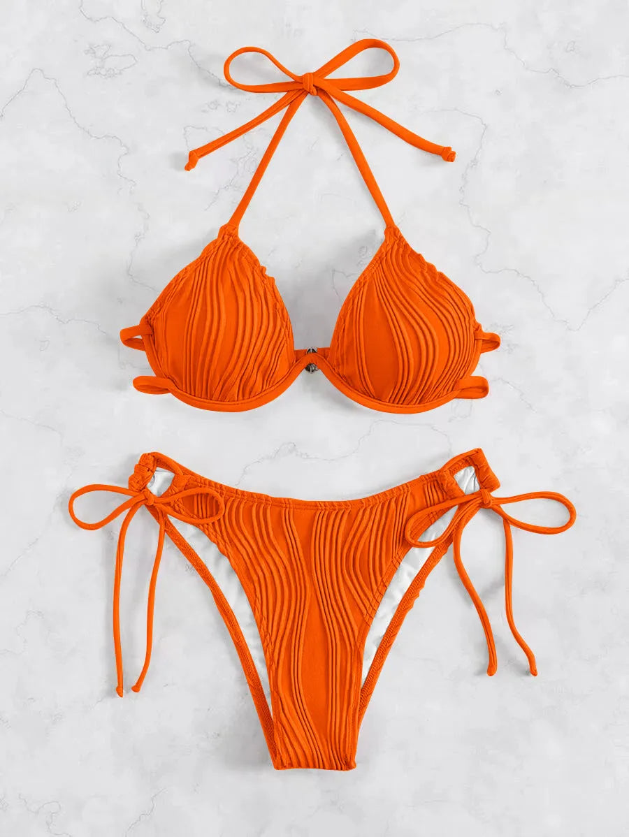 Women's apricot coloured bikini swimsuit with underwire support on a mannequin.