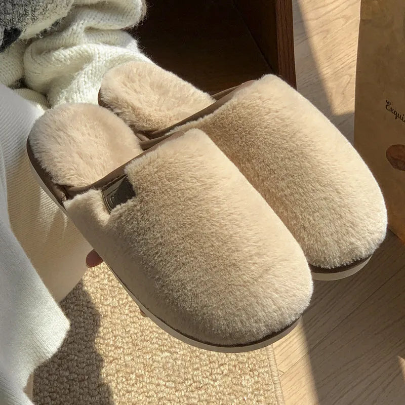 Solid colour PVC plush slippers with non-slip sole and car stitching detail on a wooden floor.