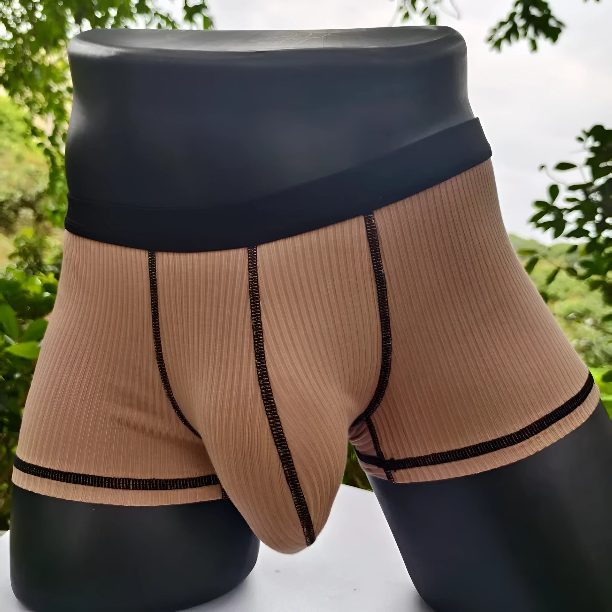 Men's breathable boxers in Army Green solid colour showing thin fabric construction and body shaping design