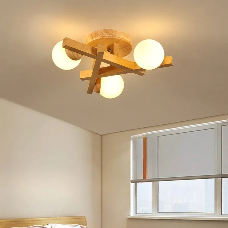 Wooden style modern Nordic ceiling light fixture with three neutral light heads.