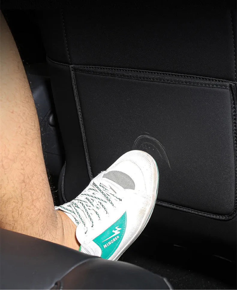 Black leather rear anti kick pad for car seat protection, showing single pocket and dimensions.