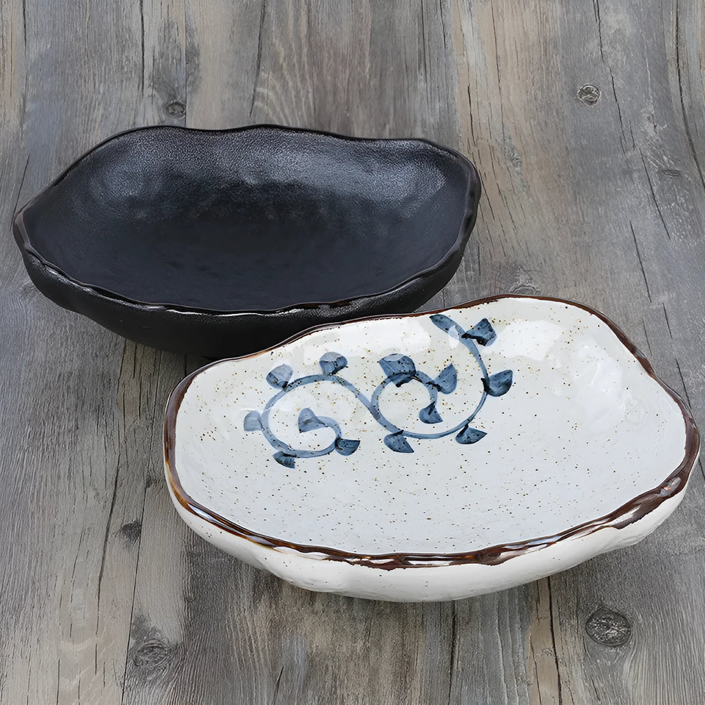 Japanese ceramic sashimi bowl with irregular shape and floral decoration pattern
