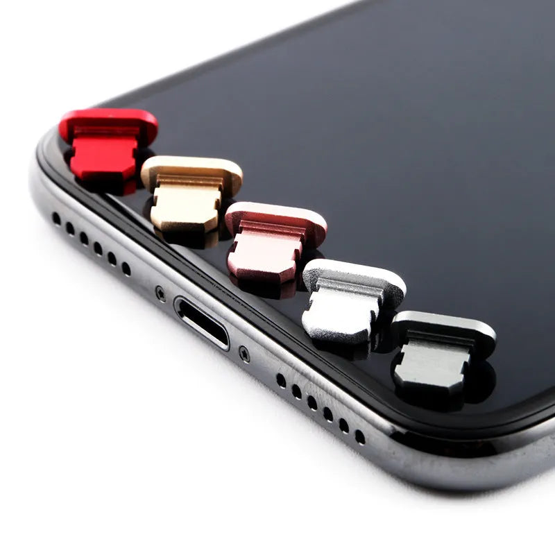 Aluminium alloy mobile phone charging port dust plug for iPhones, shown in rose gold colour.