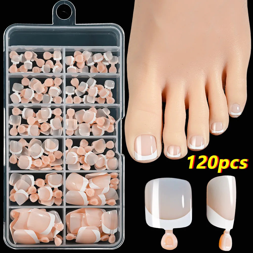 120-piece box of French white tip false toenails in nude colours, square short shape.