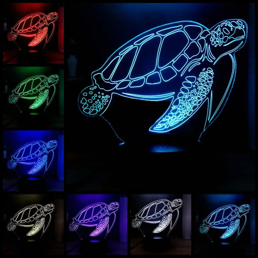3D acrylic turtle-shaped LED night light with colour-changing modes on a table.