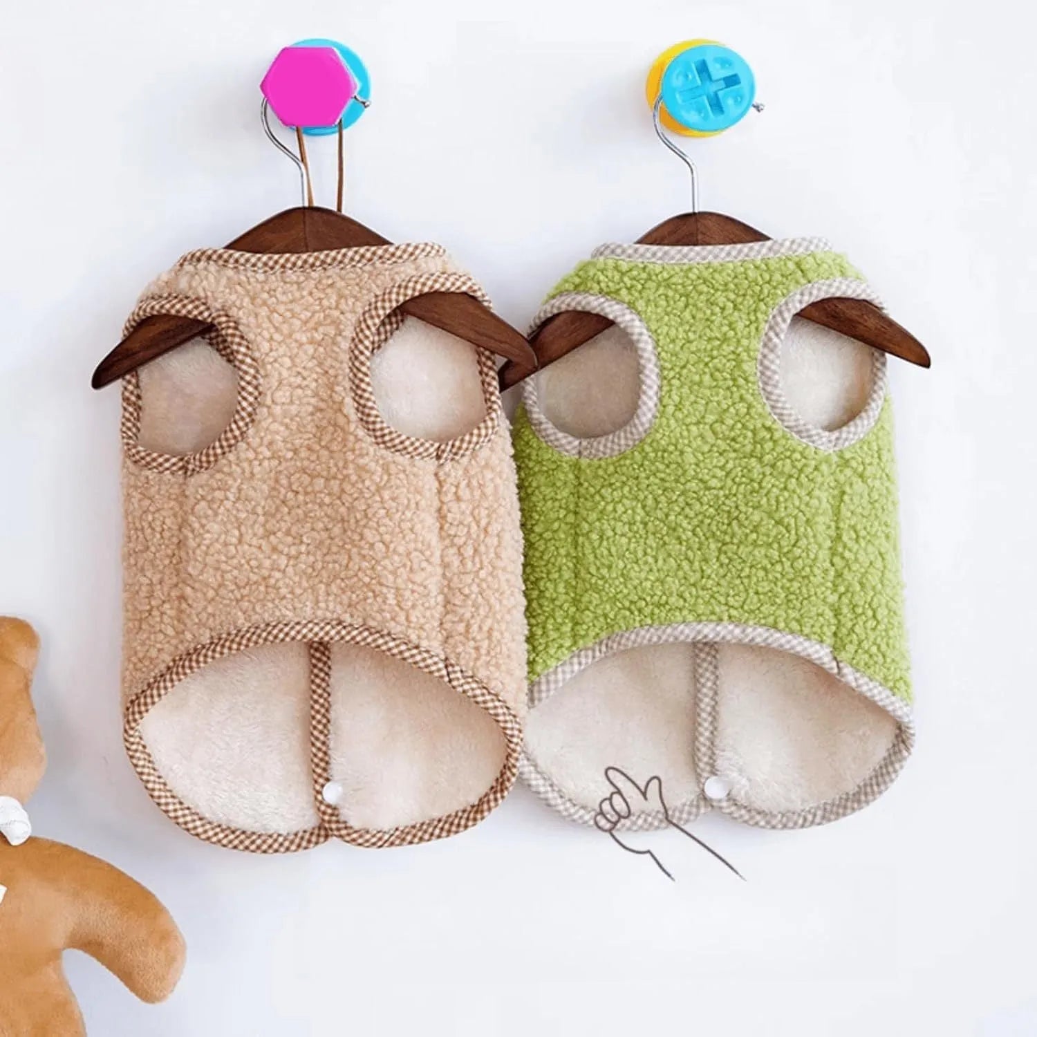 Green coral fleece dog vest with a D-ring leash attachment on a small dog.