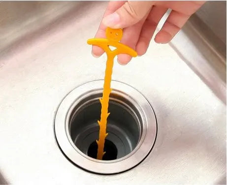 Orange colour kitchen pipe dredging hook made from soft PP, 51 cm long, with a smiling face design