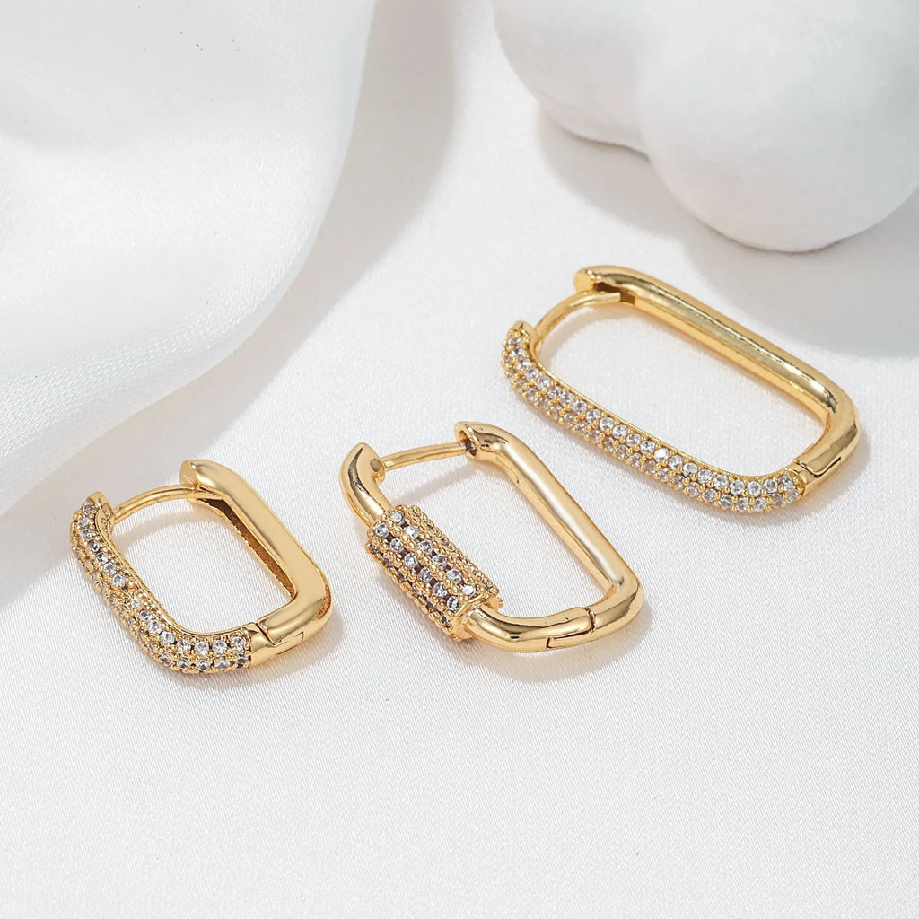 Three geometric square ear clips with micro inlaid zircon detailing in gold and white gold colours