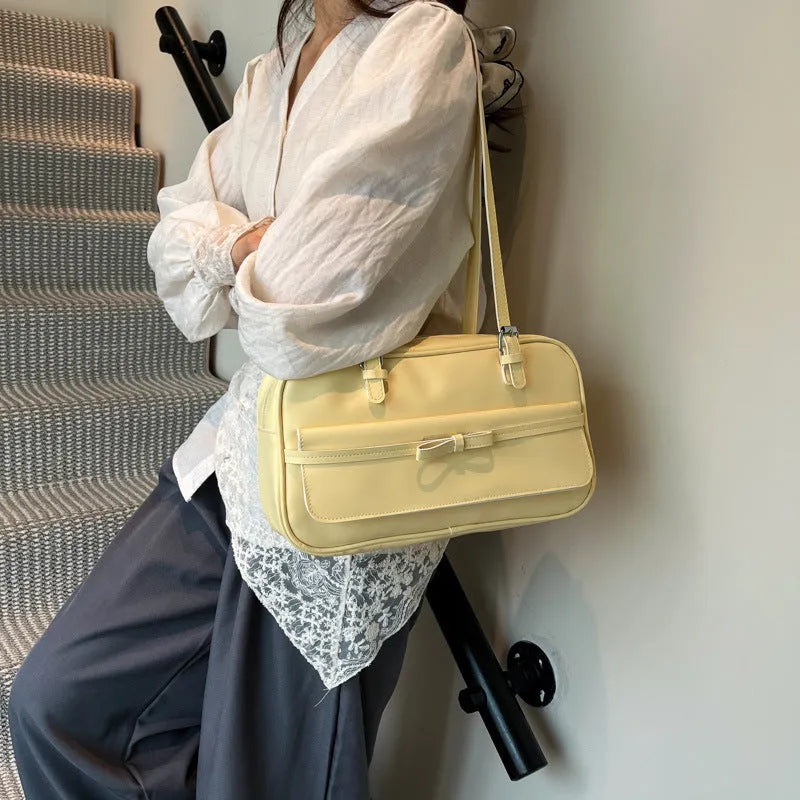 Women's black PU leather single-shoulder flap bag with a phone pocket and double-joint straps.
