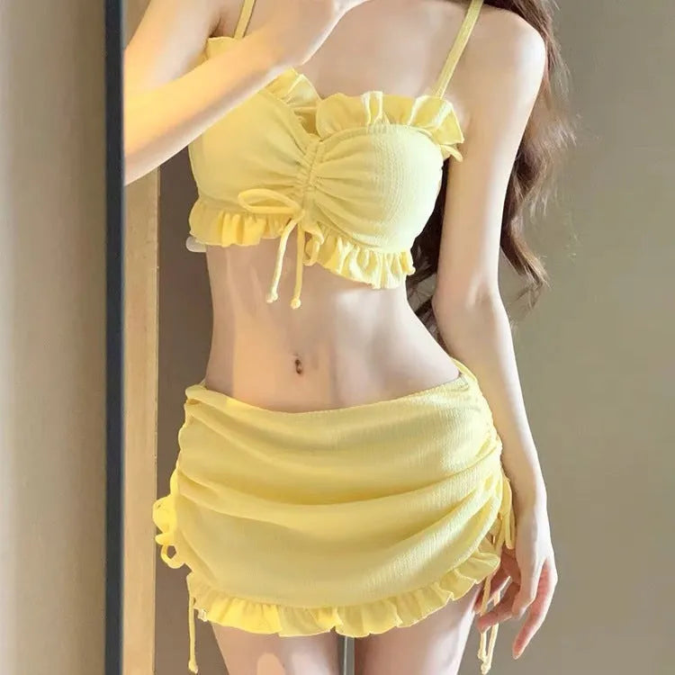 Women's split bikini swimsuit in milk silk fabric, shown in solid pitaya red, yellow, or black.