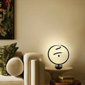 Black musical note shaped Bluetooth light with remote control and RGB colour changing capabilities