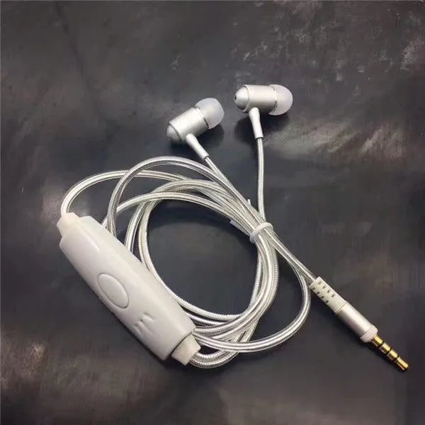 Blue LED light up earphones with 3.5mm plug and in-line remote control on a dark background